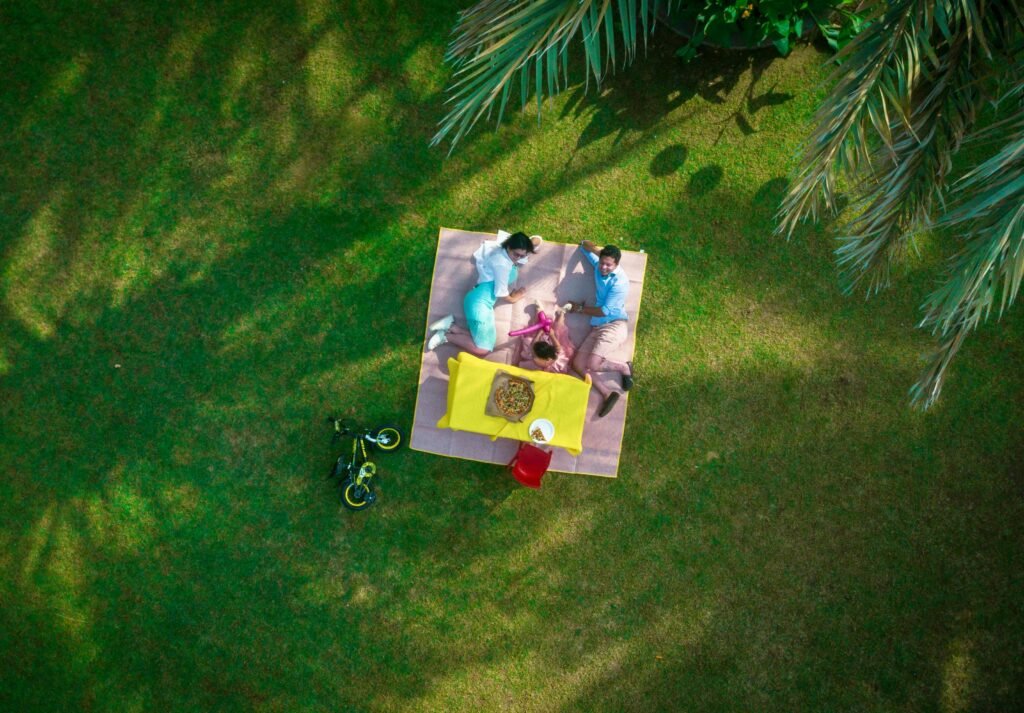 two people laying down and having a picnic in the park